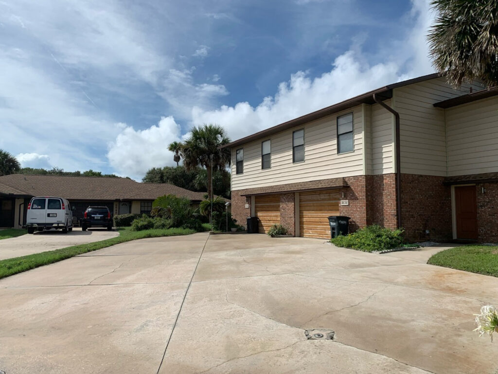 Concrete driveway being pressure washed