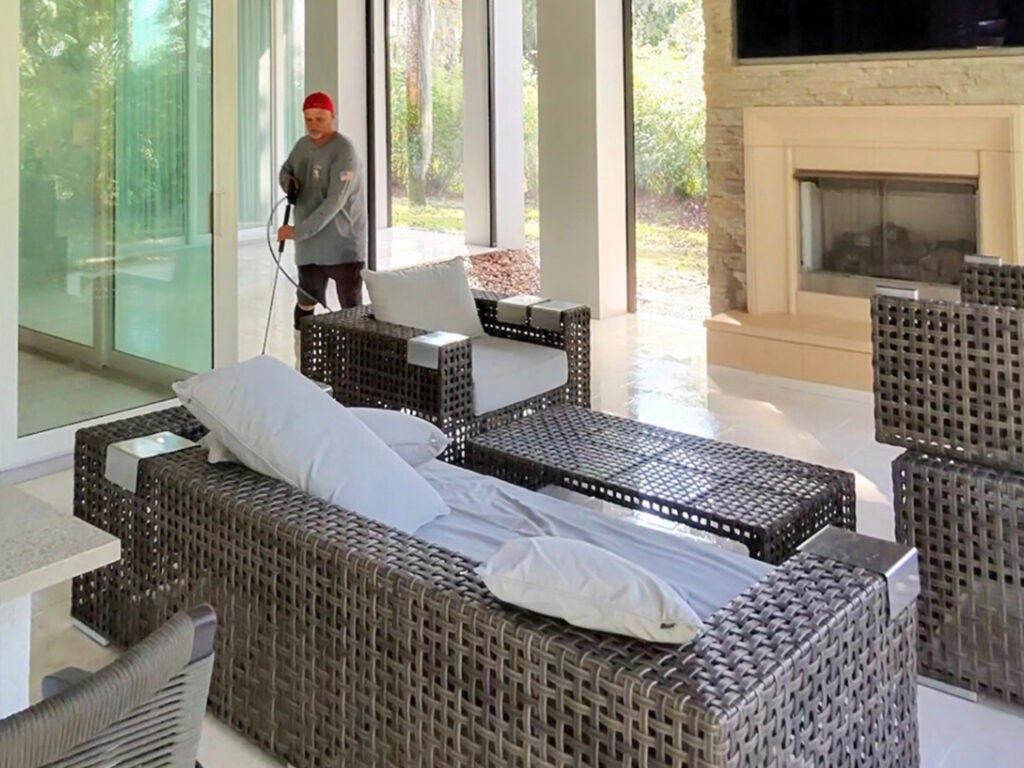 Pool cage and patio being cleaned